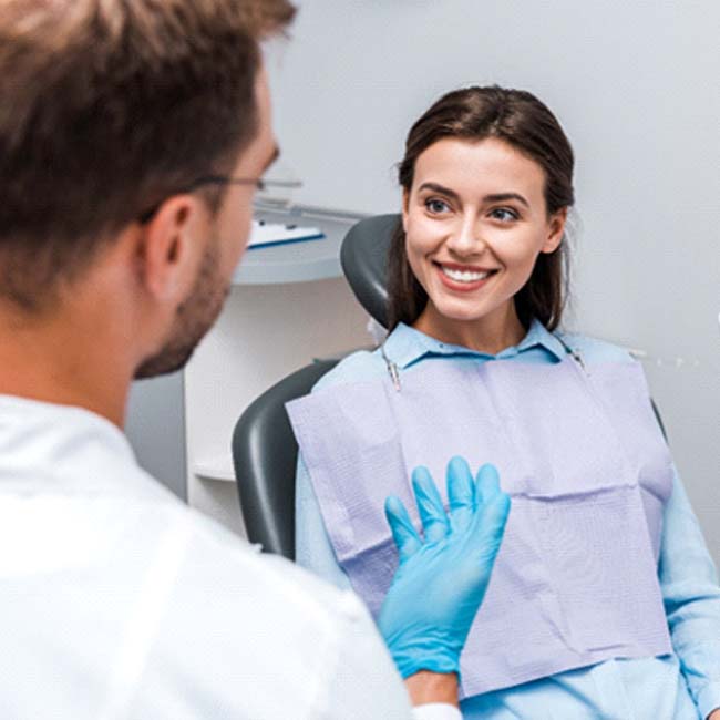 dentist explaining advanced dental implant technology to a patient